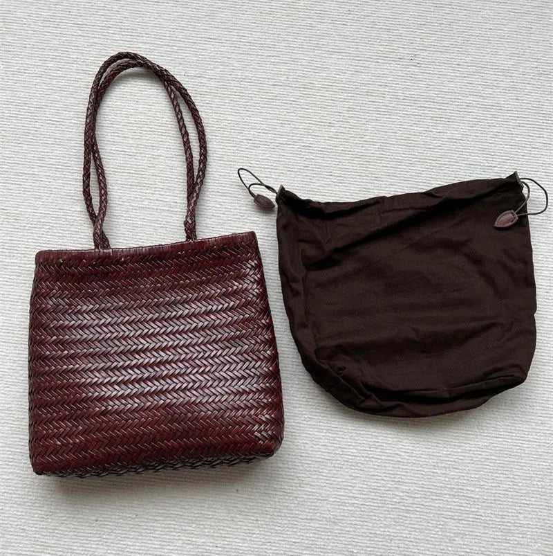 Brown woven leather tote bag with three-dimensional pocket, showing 27x30x6cm dimensions and handmade construction