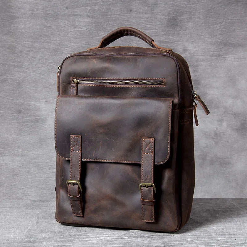 Dark coffee coloured handmade leather backpack with internal computer and mobile phone pockets.