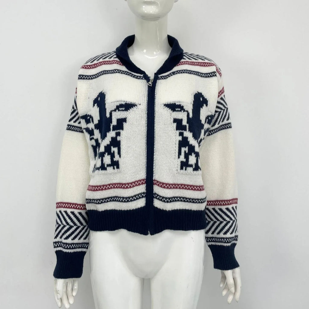 White women's zip cardigan with a contrasting striped jacquard lapel on a hanger.