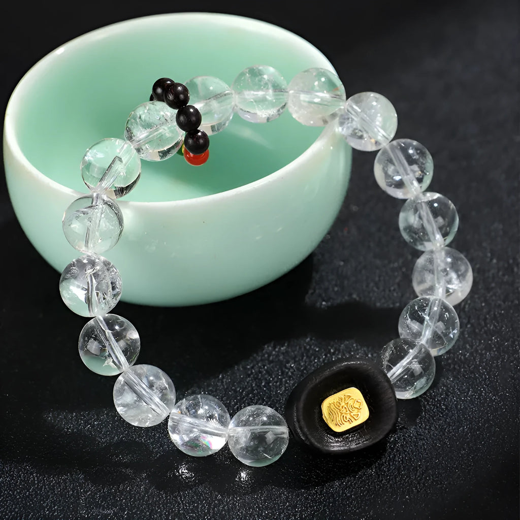 Natural white crystal ebony five warp bracelet on wrist showing wooden beads and ethnic design