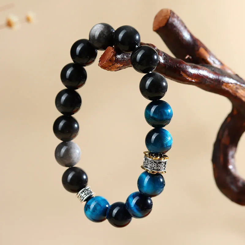 Handmade peacock blue Tigereye stone bracelet with geometric round design and adjustable wristband
