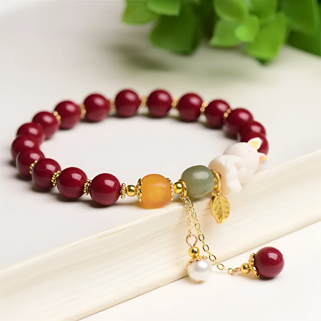 Natural Tian Yu cinnabar bracelet in purple gold sand colour with rabbit design, shown in 8mm and 10mm width options