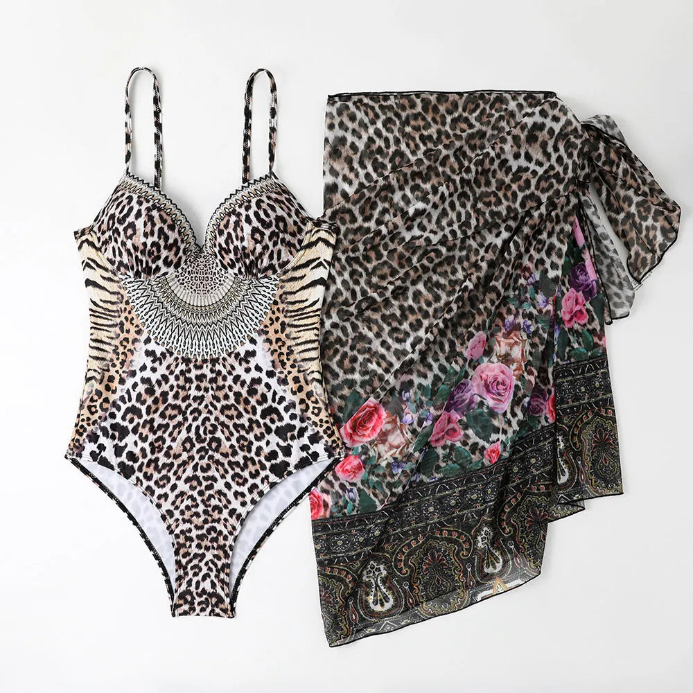 Women's leopard print one-piece swimsuit with a long mesh cover-up dress.