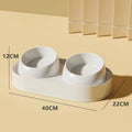 White elevated pet feeder with tilted ceramic bowls on a separate rack, for cats and small dogs.