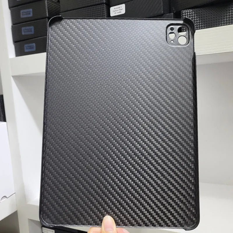 Carbon fibre flat protective cover for iPad Pro 11 showing embossed plaid pattern and precise port cutouts