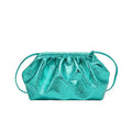 Simple hair clip shoulder crossbody bag in shell shape with sewing line details, shown in rose red colour with zippered compartments.