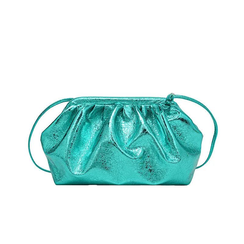 Simple hair clip shoulder crossbody bag in shell shape with sewing line details, shown in rose red colour with zippered compartments.