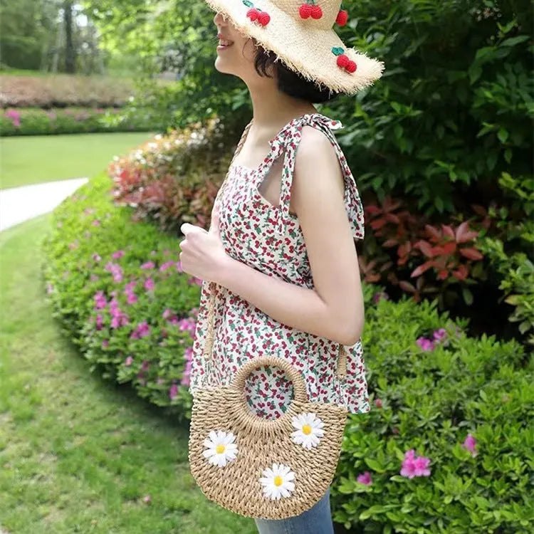 Women's light brown straw-weaved crossbody bag with daisy decoration, 25cm wide