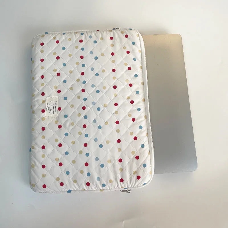 Women's polka dot polyester laptop bag shown in three sizes for 11-inch, 13-inch, and 15-inch laptops.