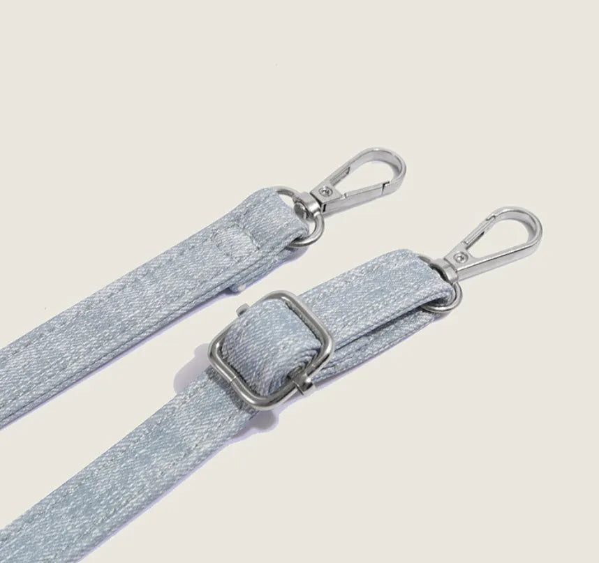 Women's casual shoulder bag in denim blue or white colour made from soft PU material