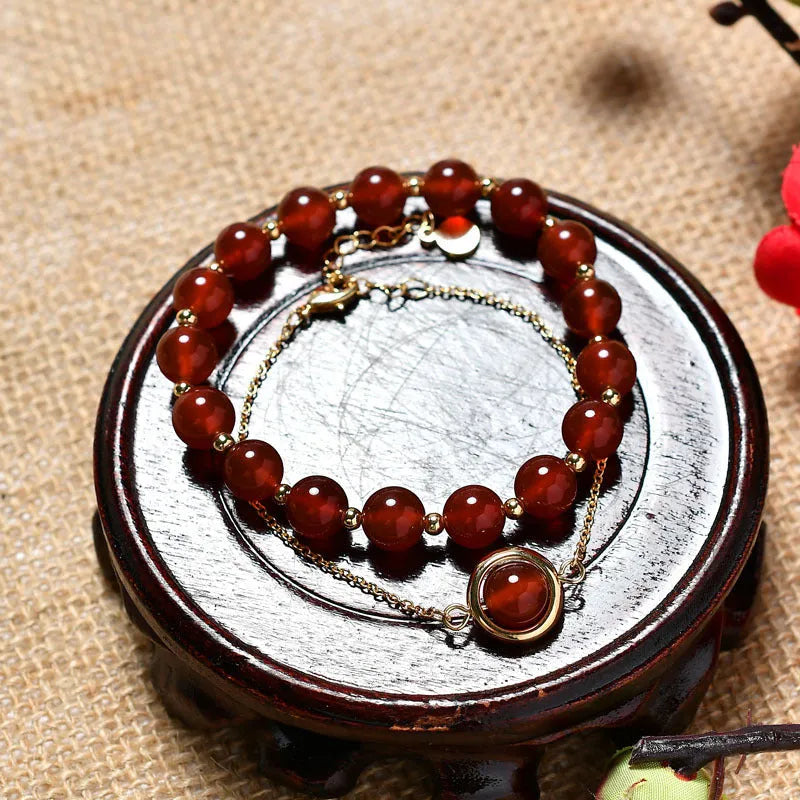 Women's double-layer copper bracelet with gold plating, strawberry quartz crystals, and lucky beads.