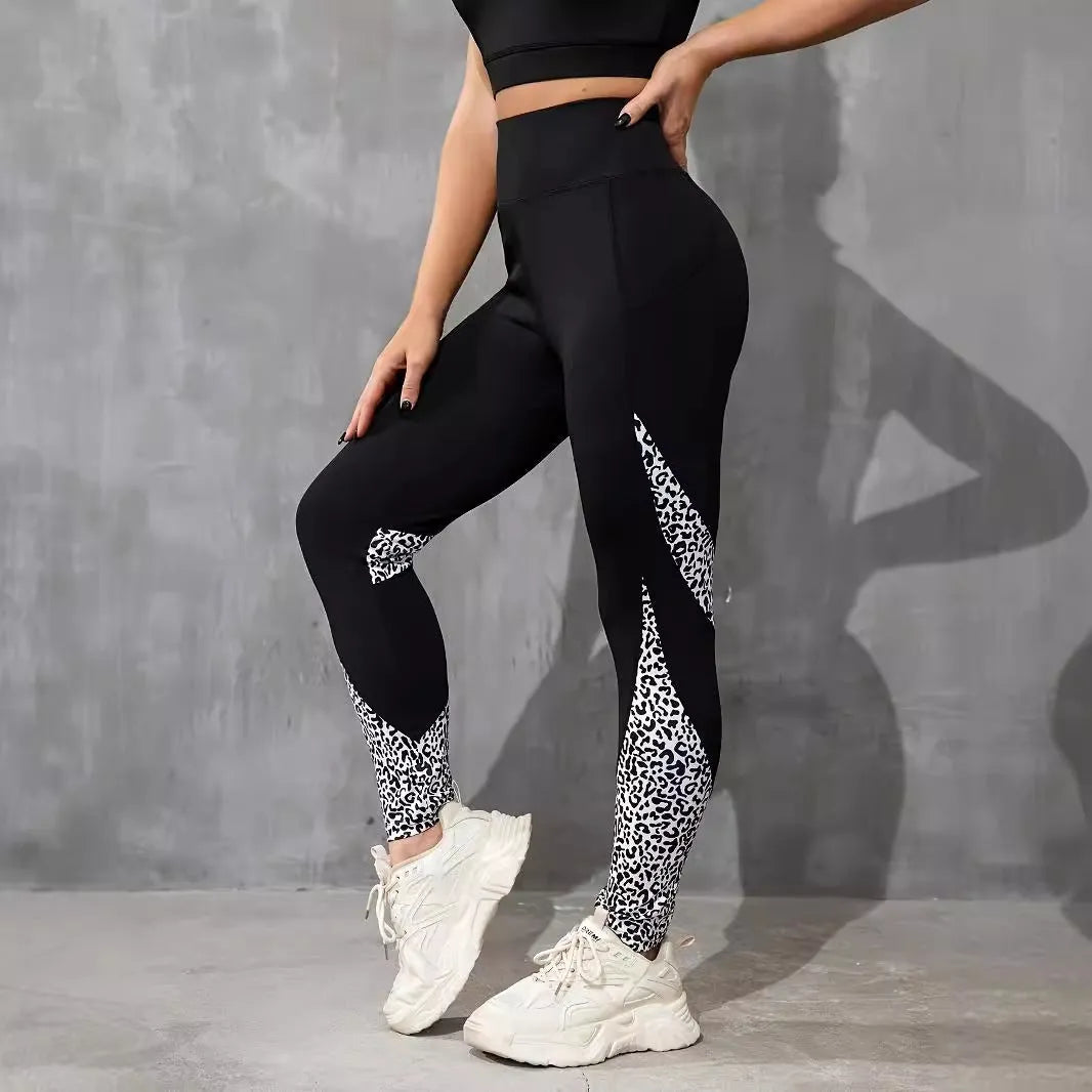 Women's black polyester yoga leggings with side pocket and leopard print pattern detail