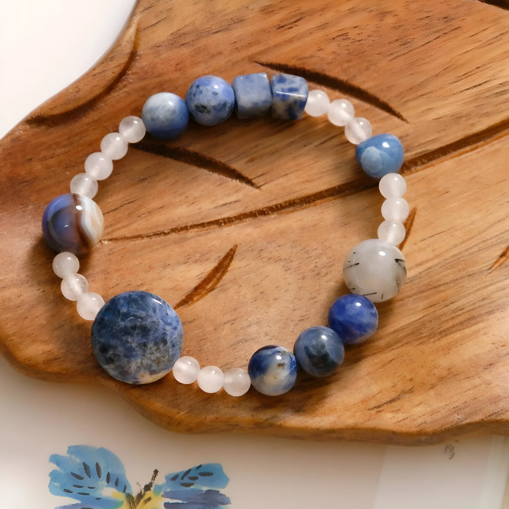 Hand-woven natural stone bracelet with blue point stone and black hair crystal agate in geometric design
