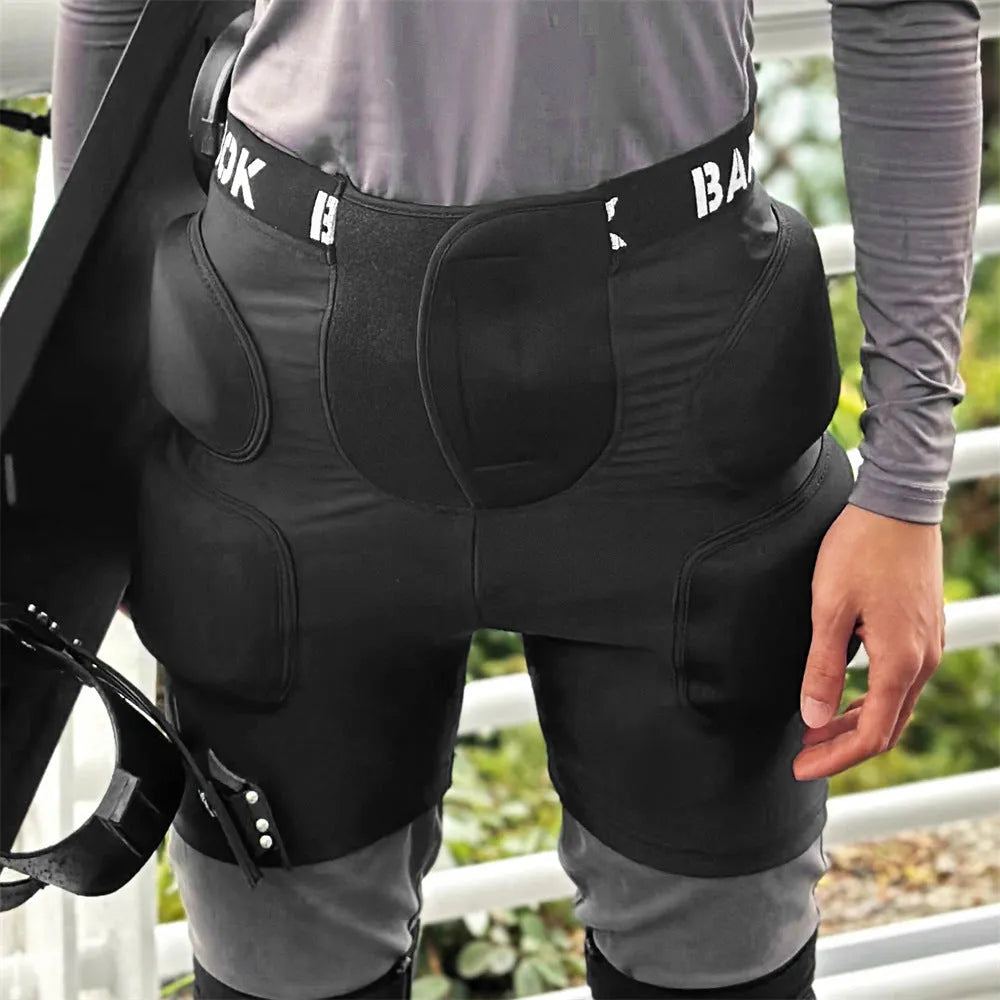 Black skating hip protection pants with integrated NBR foam pads for impact absorption during falls