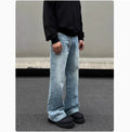 Men's blue straight-leg jeans with whisker wash detailing and a flared leg.
