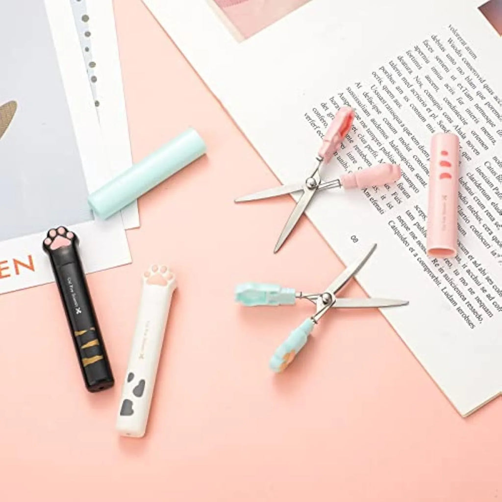 Cat paw mini folding scissors in four colours showing stainless steel blades and compact 8.7cm size