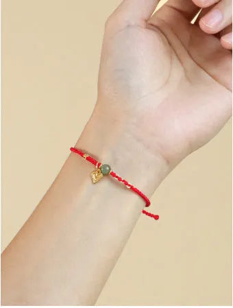 Handmade 925 silver and Hetian jade woven bracelet with red strap