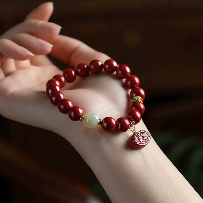 Cinnabar bracelet with Emperor Sandstone style and Ping An Fu Lu design in 8mm or 10mm bead size