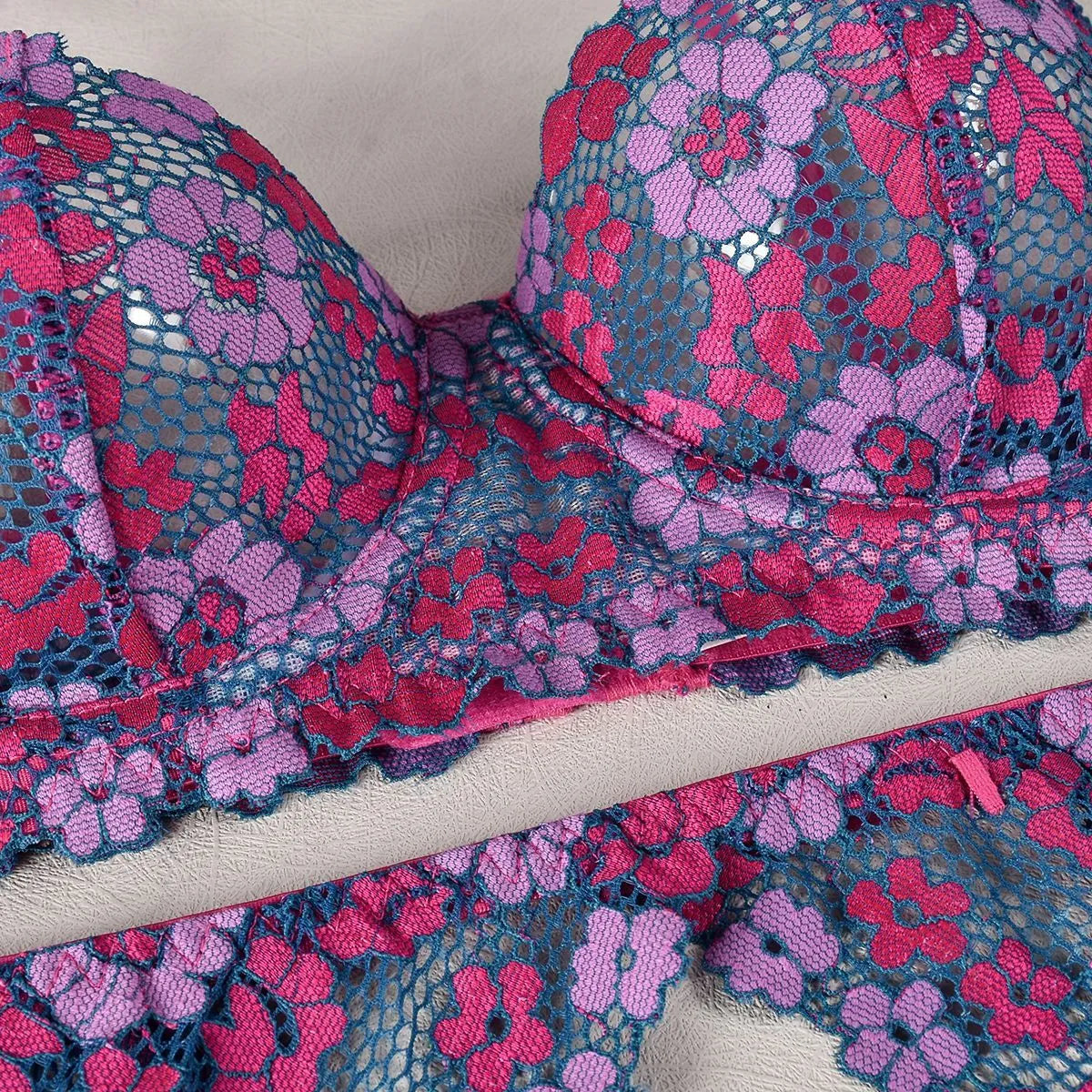 Rose red women's embroidered bikini set on a white background