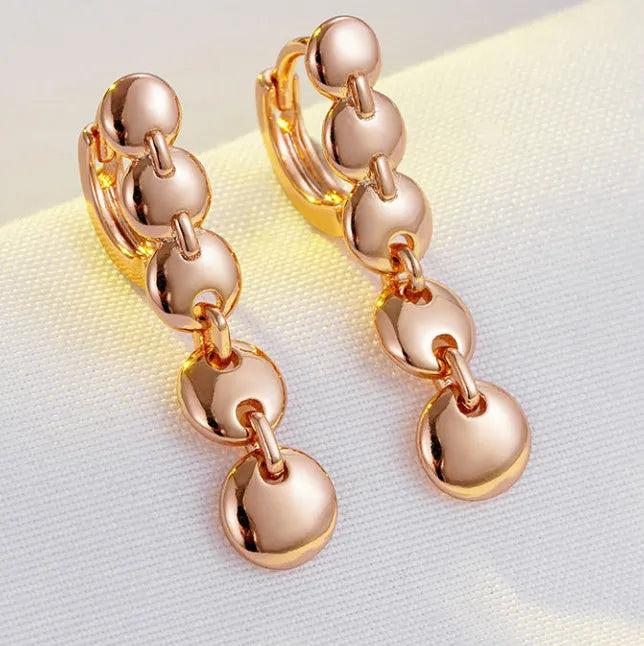 Gold-plated copper circle earrings with hand-woven texture, measuring 6cm in length