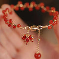 Red electroplated alloy bracelet with Chinese style maple leaf design and magnetic closure for girls