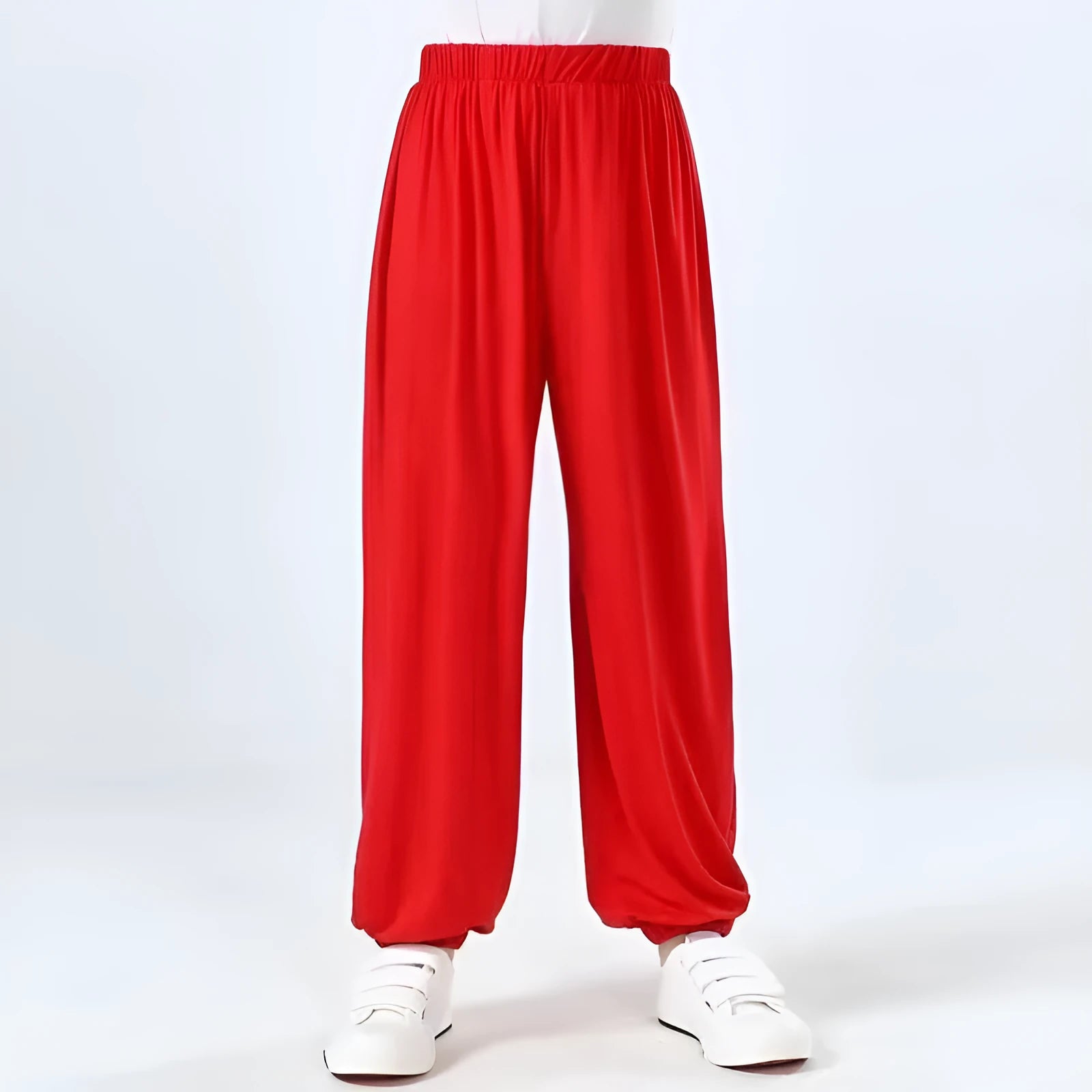 Black children's high-elasticity Lycra practice pants for Sanda martial arts training on a white background.