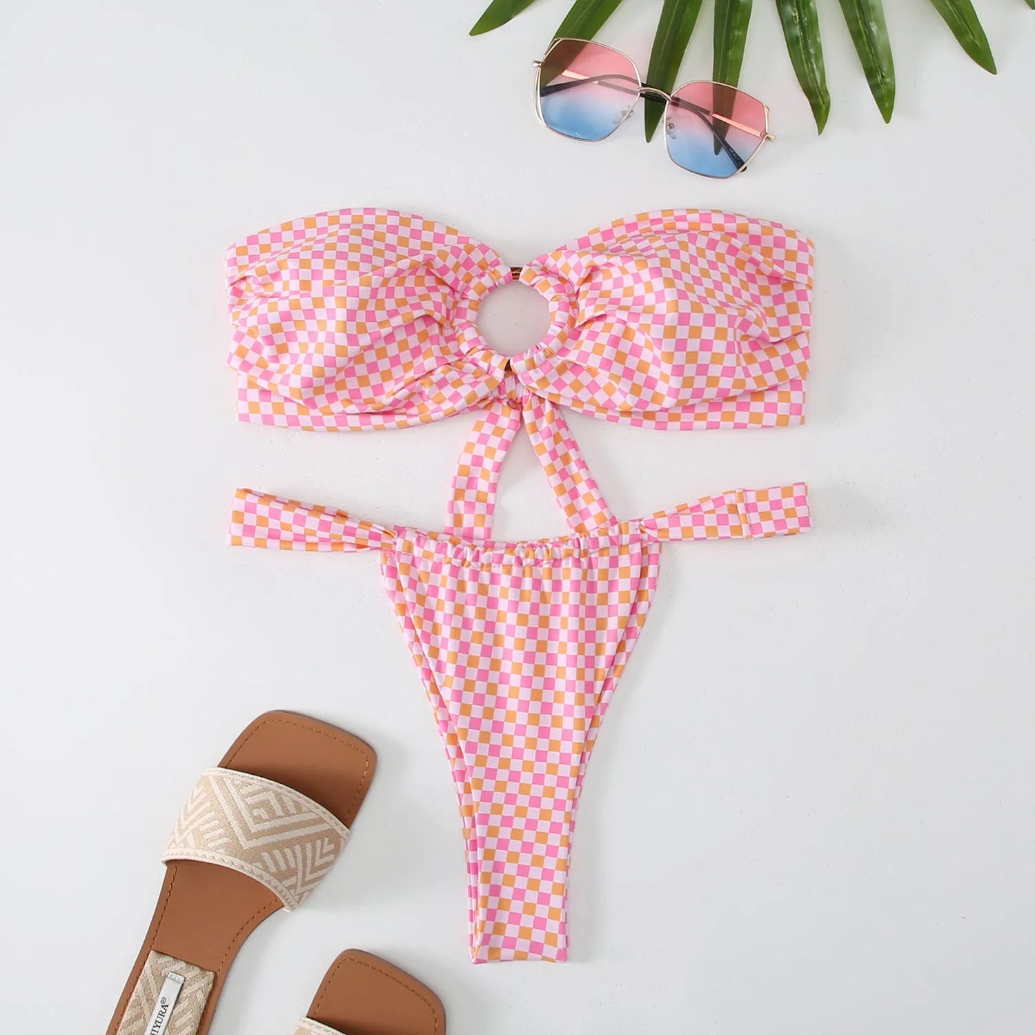 Women's floral printed tube top ring bikini swimsuit in a backless briefs style.