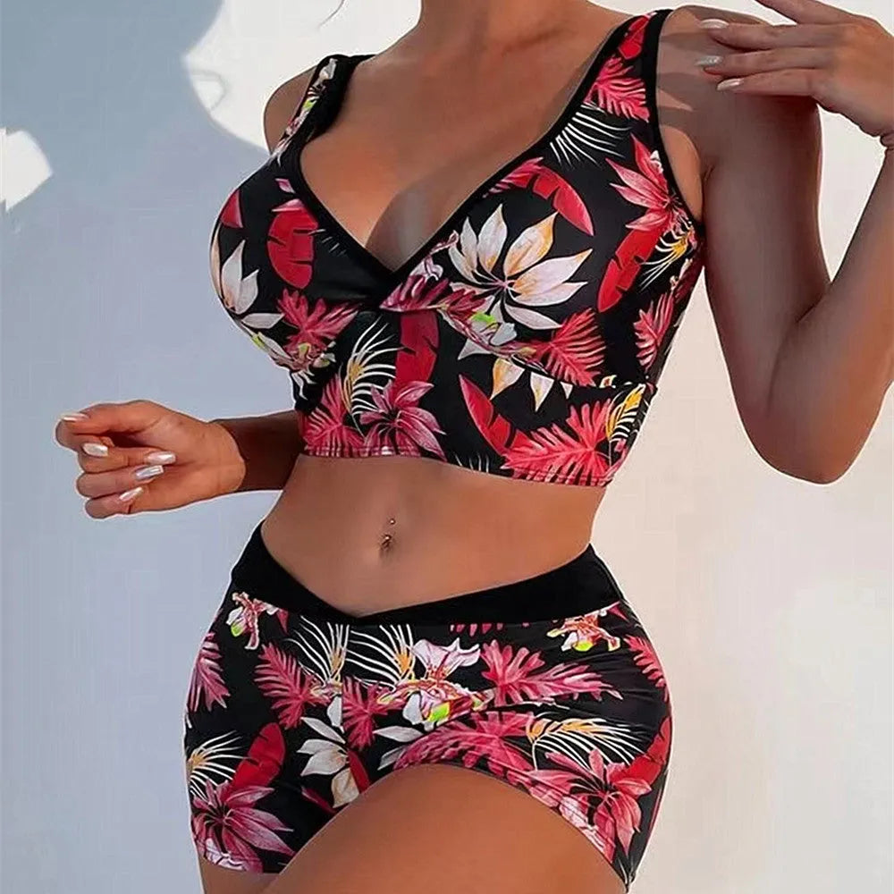 Two-piece swimsuit with printed boxer briefs in multiple colours, sleeveless top, and briefs style for female swimmers