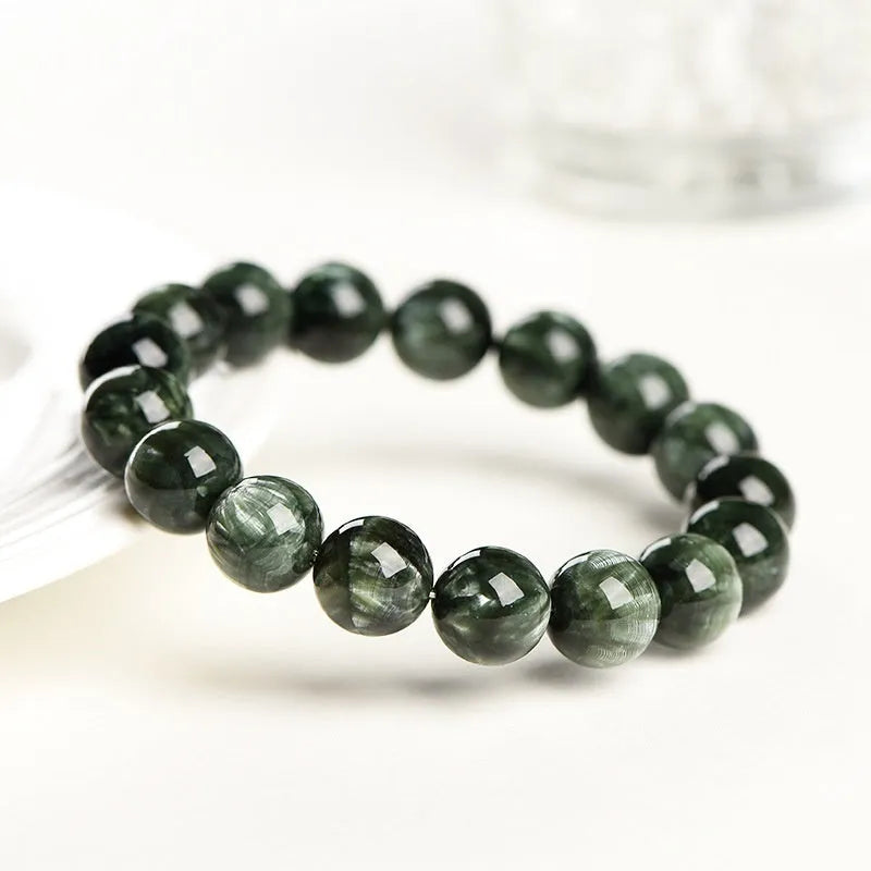 Green Dragon Crystal bracelet with 8-9mm round beads showing Ruyi design detail and geometric shape