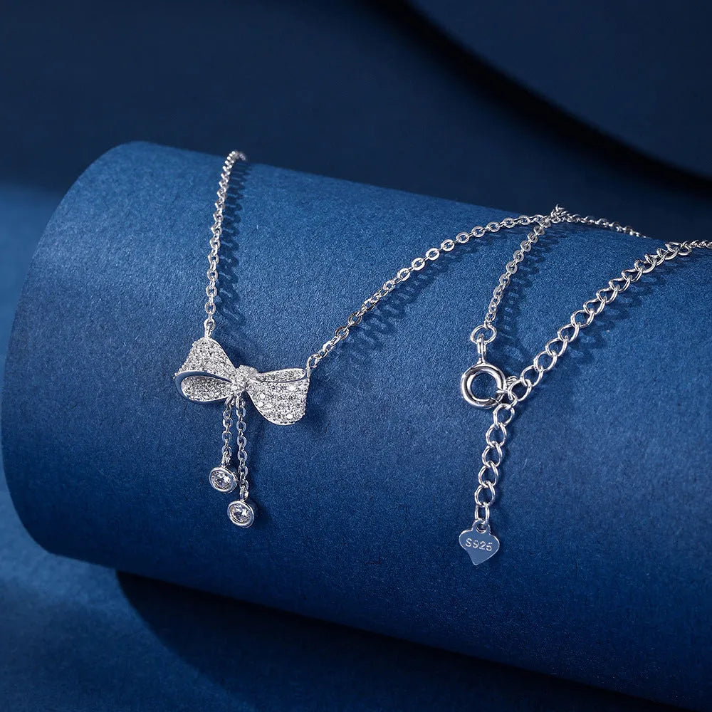 S925 sterling silver bow necklace with adjustable 40-45cm chain and electroplated silver finish