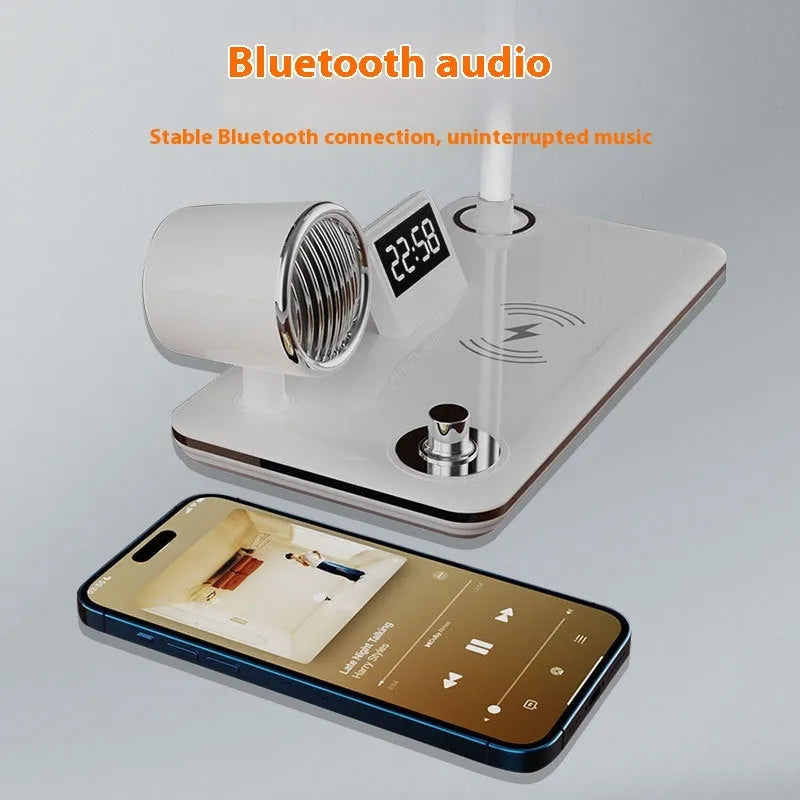 White and black intelligent table lamp with digital clock display and wireless charging pad on base.