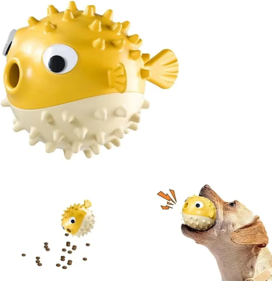 Green fish-shaped interactive dog toy with treat dispensing feature and dental cleaning particles