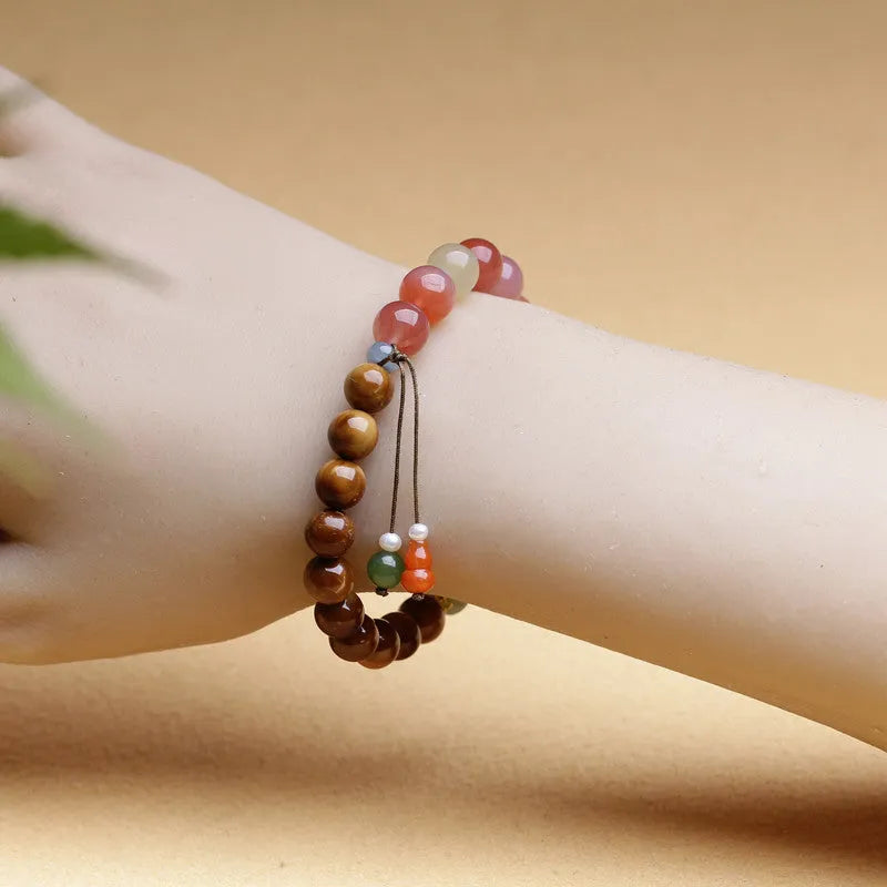 8mm agate bracelet with diamond-cut beads showing natural persimmon colour variations