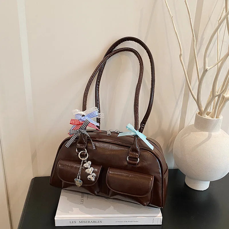 Retro pillow-shaped women's PU handbag in black with double shoulder strap and flap closure