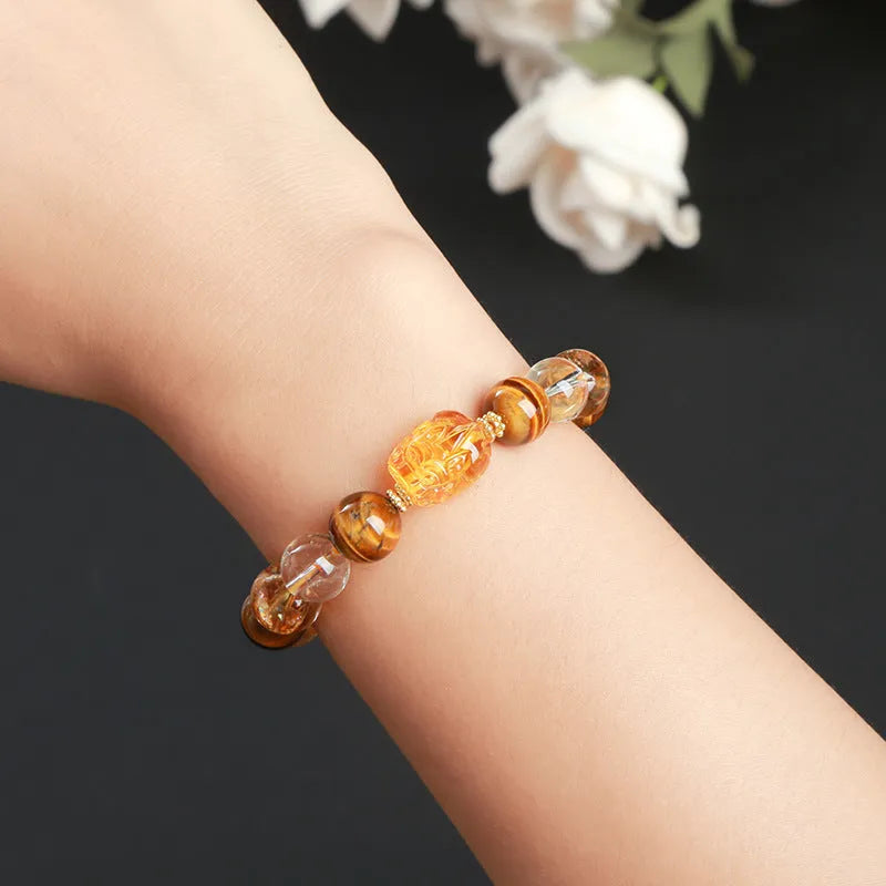 Yellow tiger's eye and citrine bracelet with 10mm round beads, pi xiu charm, and steel fittings