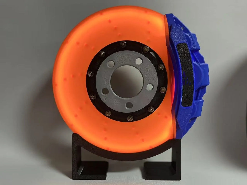Blue brake disc LED rechargeable night light with touch dimmer on a desktop