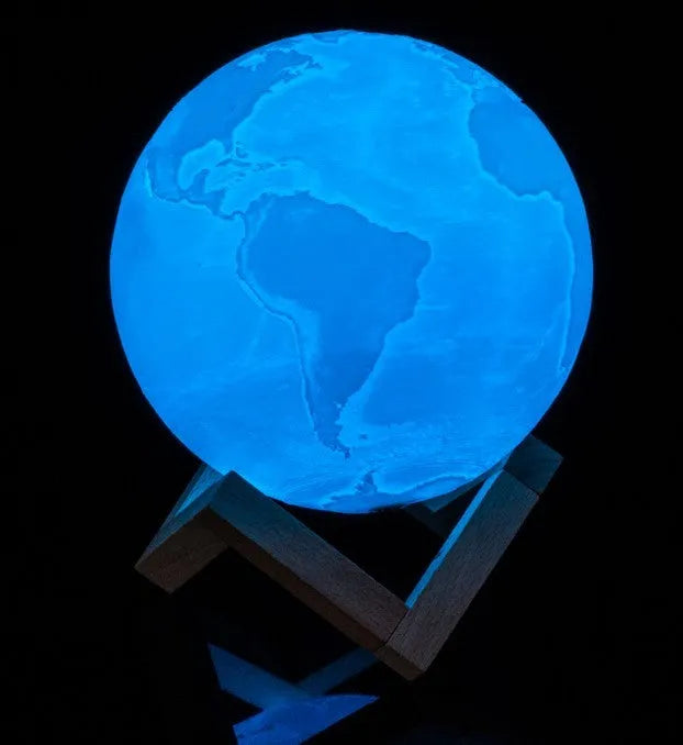 3D printed spherical moon lamp with visible surface contours and touch-sensitive metal ring at base