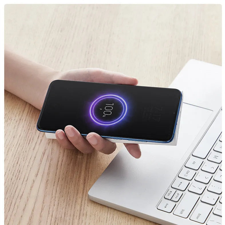 White or black 10000mAh power bank with USB Type-C port and wireless charging surface