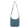 Leather women's casual zip crossbody bag in top grain genuine leather with canvas lining and open outer pocket.