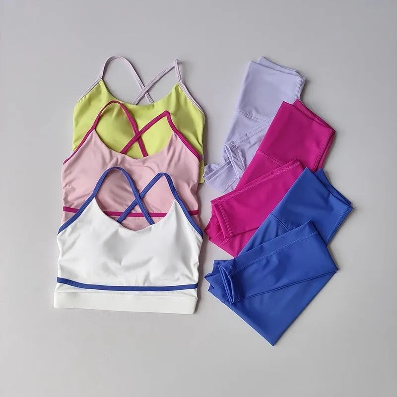 Women's blue and white quick-drying nylon spandex yoga set with sleeveless tank top and cropped pants.