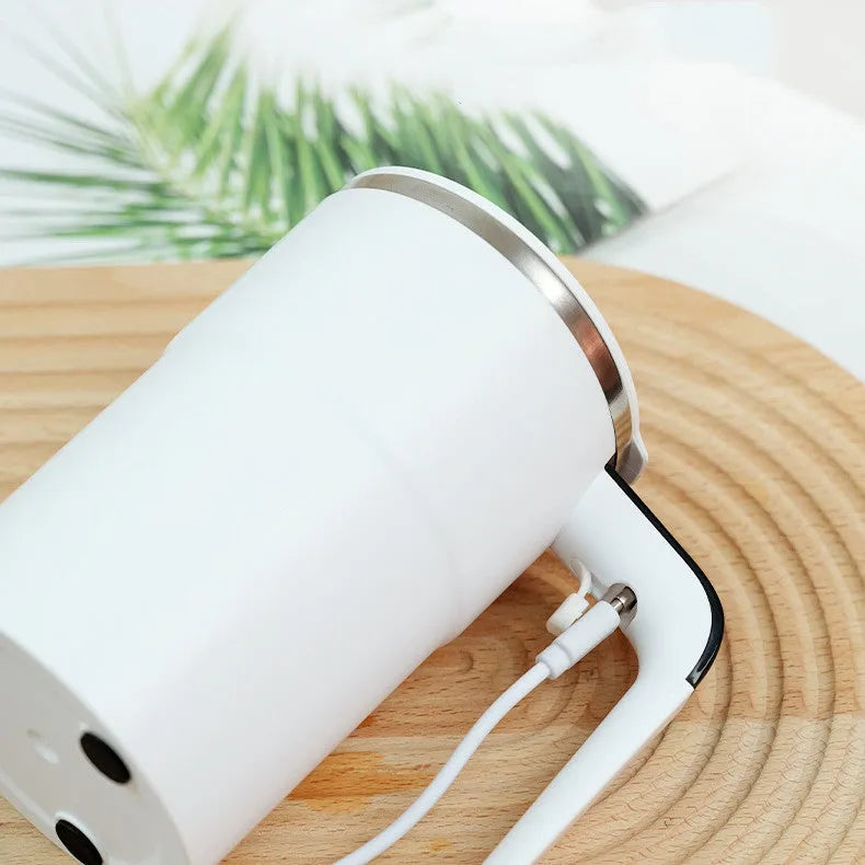 White electric stirring mug with LCD temperature display and magnetic stirrer base