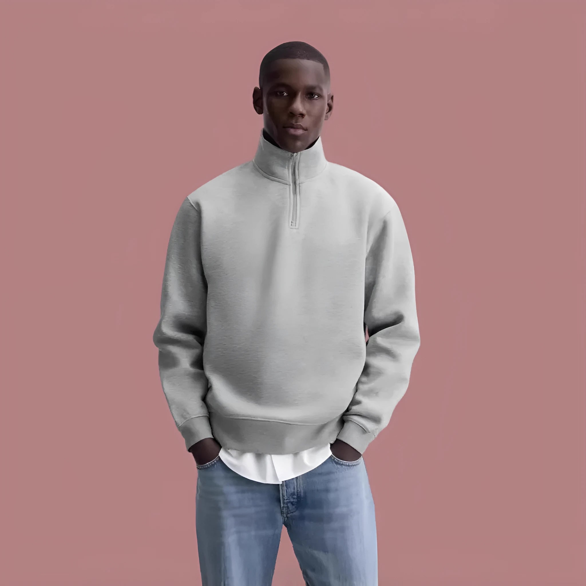 Half-zipped grey cotton sweatshirt with stand collar, long sleeves, and casual grunge style texture