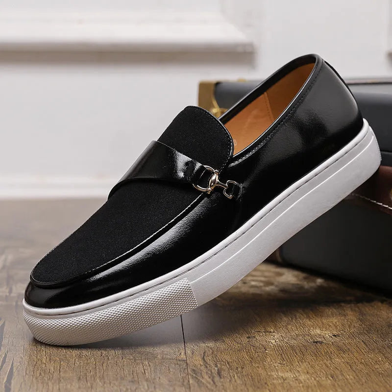 Men's black slip-on loafer with a gold horsebit buckle, round toe, and visible stitching.