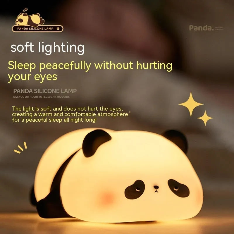 Panda-shaped night light with soft silicone surface, measuring 150x130x80mm, showing warm white glow
