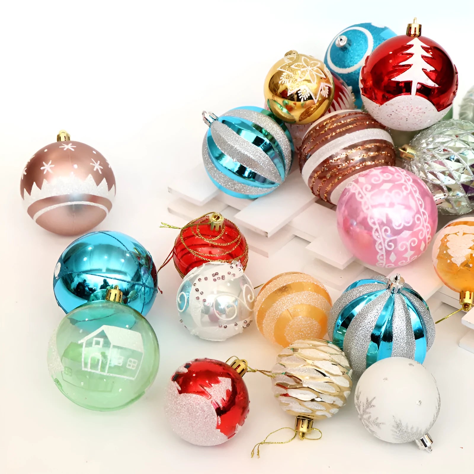 Set of 24 hand-painted 6cm Christmas baubles with glitter plating in various colours including gold, red and blue
