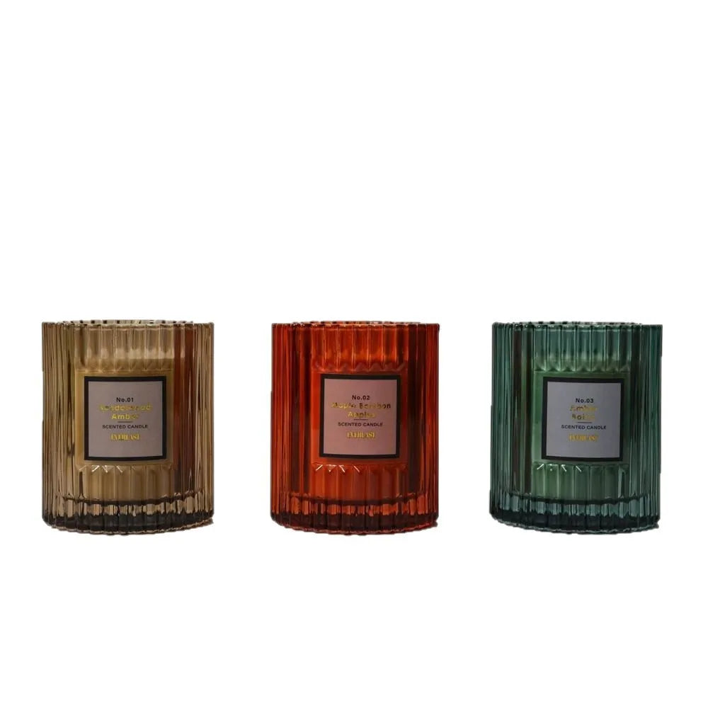 Soy wax aromatherapy candle in cylindrical shape showing amber, green and red colour options