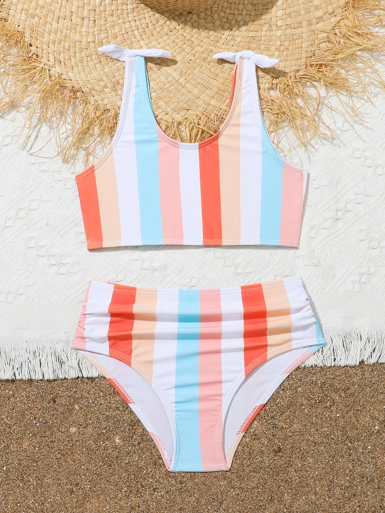 Girls plaid print swimsuit briefs with bra top, shown in multiple toddler and child sizes.