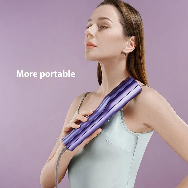 Handheld garment steamer showing its nozzle, controls, and plastic clip on a white background.