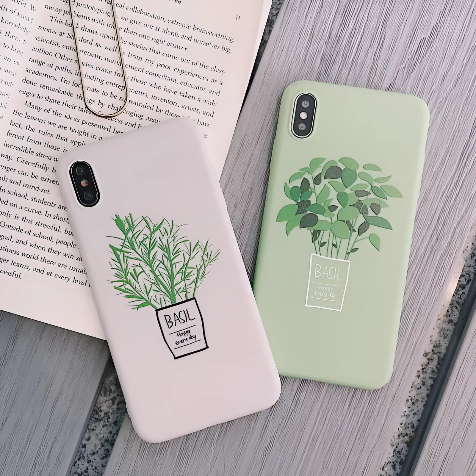 White silicone iPhone case with a detailed painted leaf and plant pattern on the back.