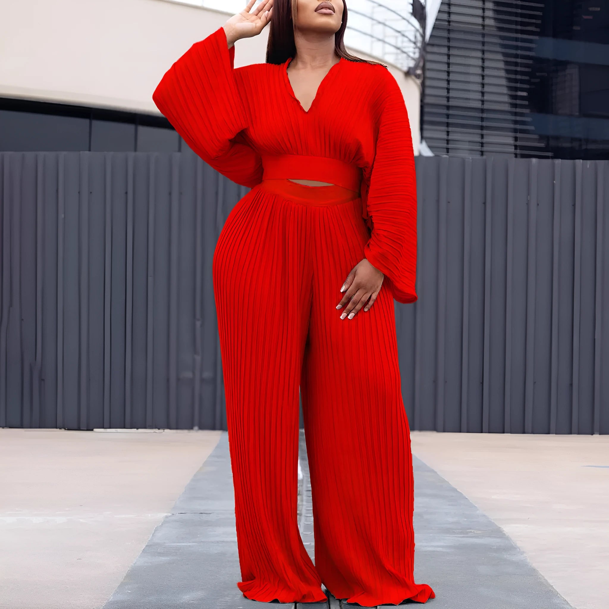 African suit two-piece set featuring a batwing sleeve top and wide-leg trousers in red or sapphire blue.